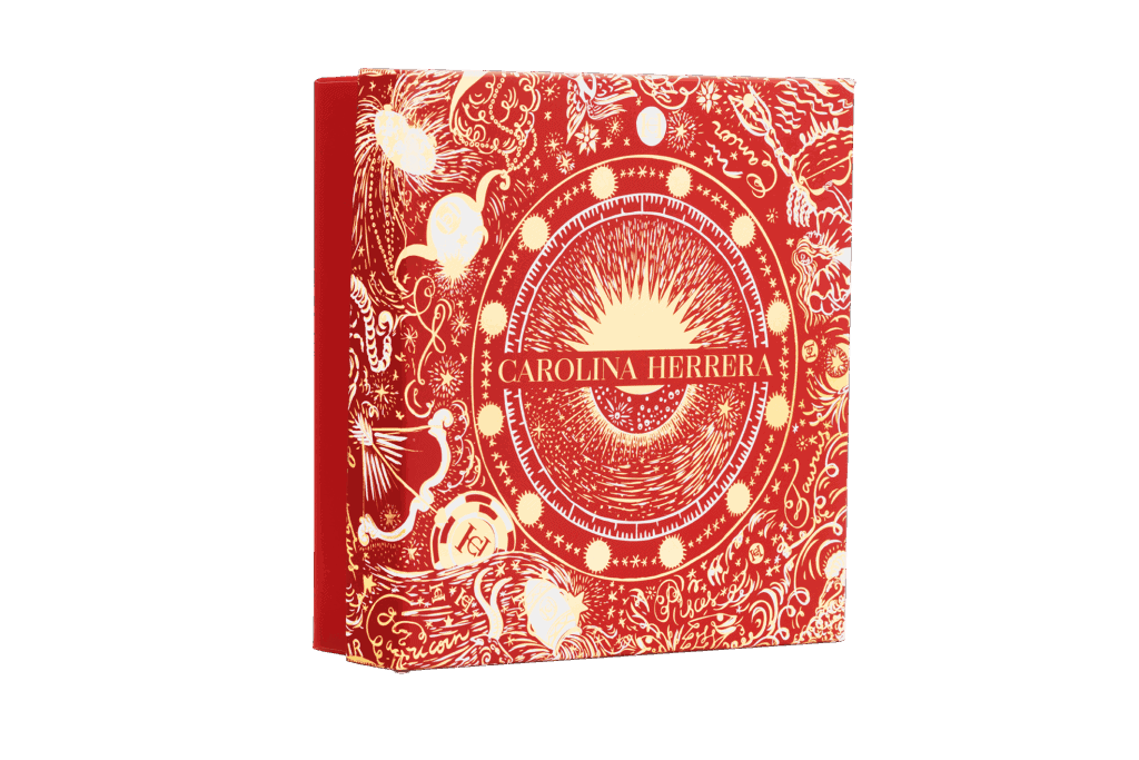 Innovadora caja de packaging de lujo con diseño artístico en tonos rojos y dorados para la colección de Carolina Herrera.